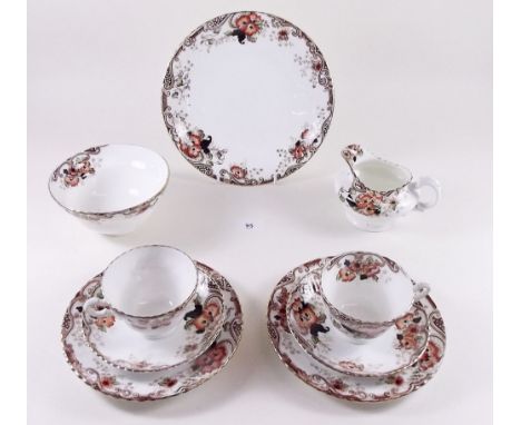 An Edwardian tea service with floral decoration comprising: six tea cups and saucers, six tea plates, jug and sugar 
