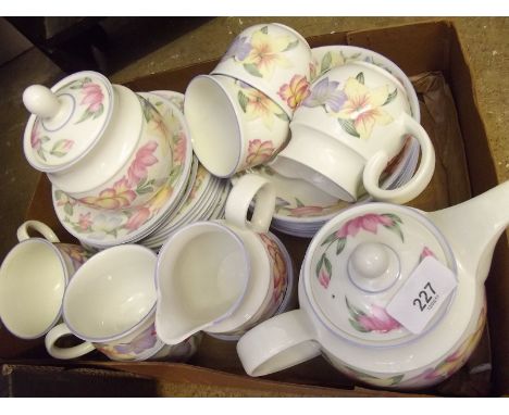 A Royal Doulton Blooms tea and dinner service comprising: teapot, milk, sugar, preserve jar, six cups and saucers, six bowls,