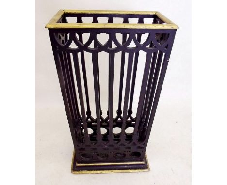 A carved ebonised and gilt stick stand 