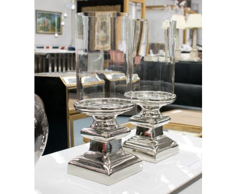 TABLE CANDLELIGHTS, a pair, removable glass tops on plated silvered pillar bases, 37cm H x 13cm W. (2)