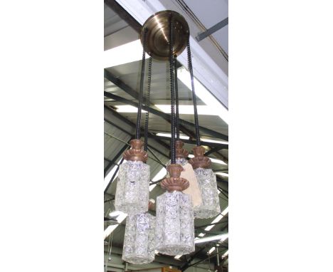 HANGING LIGHT, 1960's, having five phone wire hung moulded glass shades with carved wood and brass mounts, 120cm H.