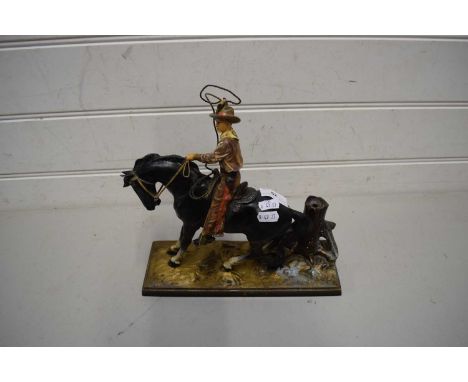 PAINTED CAST METAL MODEL OF A COWBOY ON HORSEBACK