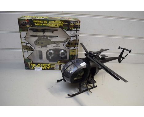 REMOTE CONTROL MINI HELICOPTER TOGETHER WITH A FURTHER MODEL HELICOPTER