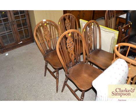 Four stick and wheel back dining chairs 