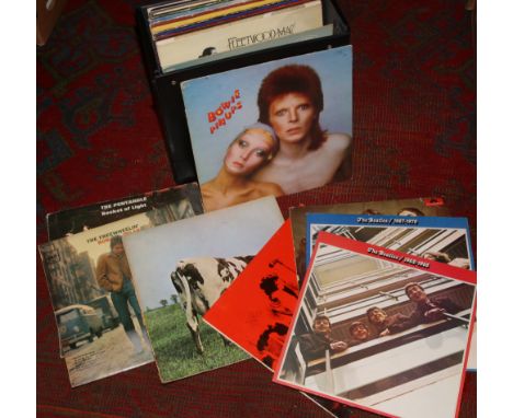 A carry case of L.P records to include Bob Dylan, Pink Floyd, The Bealtes etc.Condition report intended as a guide only.Gener
