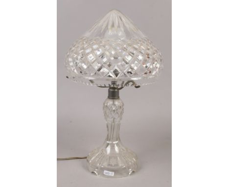 A cut glass table lamp.Condition report intended as a guide only.Chips to rim of shade.