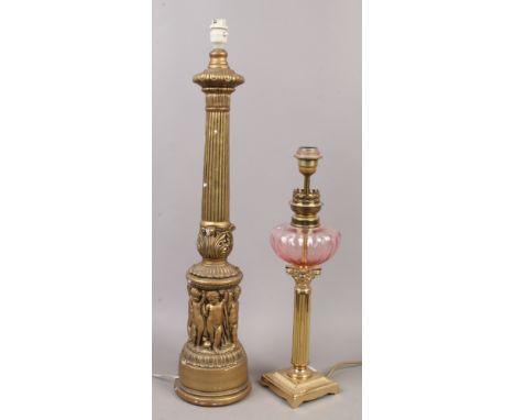 Two gilt table lamp bases, a metal example formed as an oil lamp, along with a plaster reeded column.