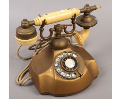 A vintage The Electra rotary dial telephone.