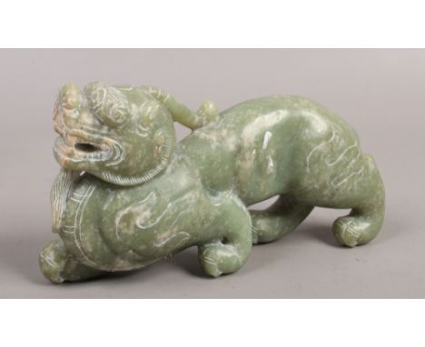 A jade coloured hardstone carving of a Chinese mythical beast.