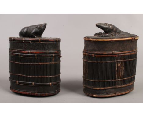 Two early 20th century Chinese bamboo cages, one surmounted with a carved crayfish finial the other a frog.