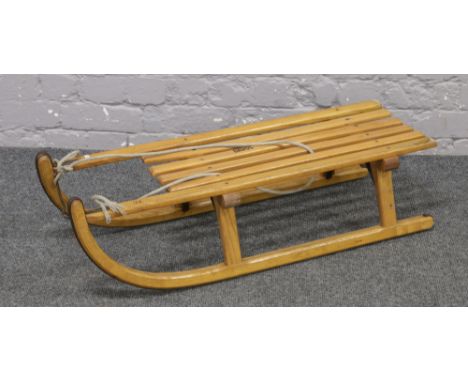 A vintage wooden Davos sledge.