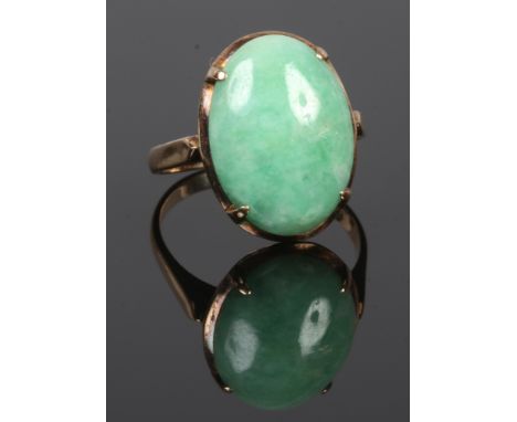 A 14ct gold ring with large jade coloured hardstone, size N.