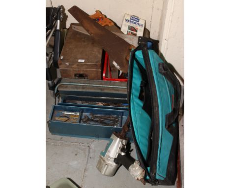 A large quantity of tools to include wood planes, saws, wooden tool box, spanners, screw drivers, Makita compressed air nail 