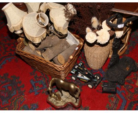 A log basket and contents of logs, cast iron stickstand, basketware stand, sea grass covered vase and a brass five branch cei