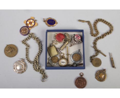 A quantity of pocket watch chain fobs including enamel and swivel examples, along with two single Albert chains, watch keys e