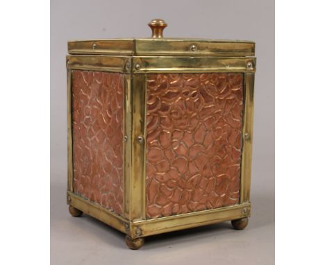 An Arts &amp; Crafts copper and brass tea caddy.