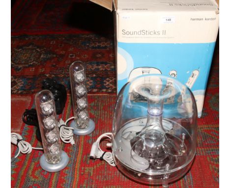 A box of Harman Kardon speaker / sound sticks.