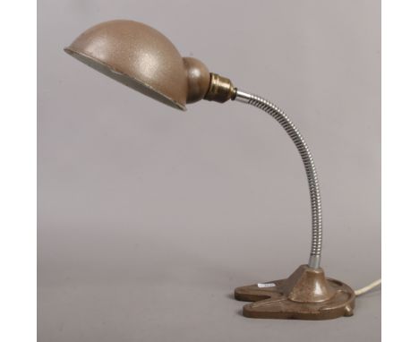 A vintage swan neck Hawkins table lamp with cast iron base.