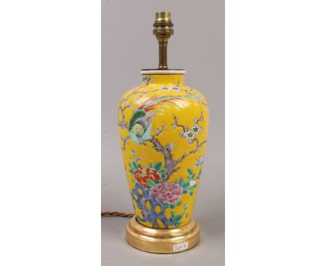 A Chinese yellow ground porcelain vase decorated with Chinese pheasant and trailing cherry blossom, converted to a lamp.