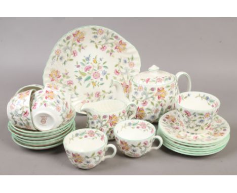 A Minton six place tea service in the Haddon Hall design to include teapot, sugar bowl, milk jug etc.