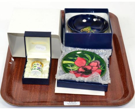 A modern Moorcroft enamel box; and two modern Moorcroft dishes (3) 