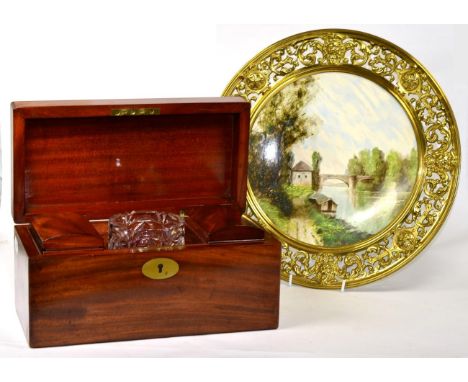 A 19th century mahogany tea caddy together with a painted charger in brass mount (2)