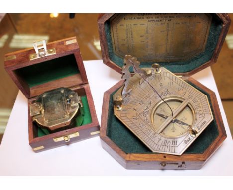 Boxed brass compass and a boxed brass sundial