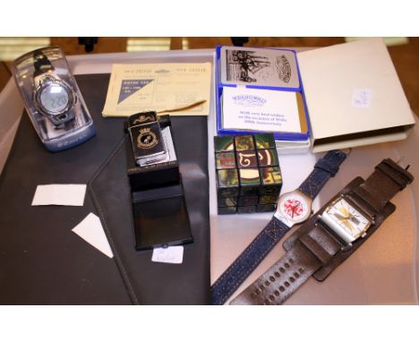 Tray of mixed wristwatches and playing cards 
