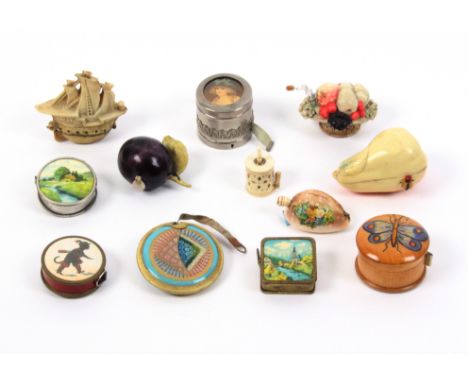 Twelve tape measures comprising four novelty celluloid examples, a pear, 6cm, a plum, a galleon, and a basket of fruit, all b