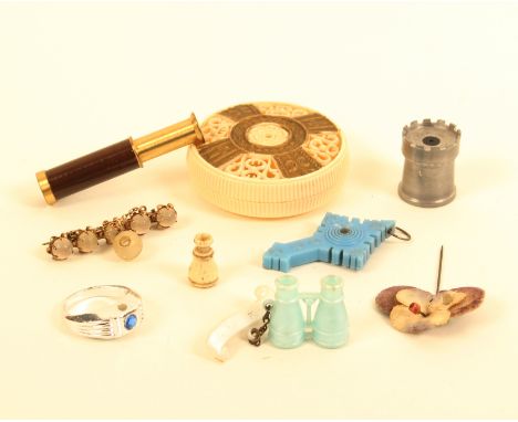 Nine charms and other objects with Stanhopes comprising a plastic circular box (Buckfast Abbey), 5cm, a plastic cross (three 