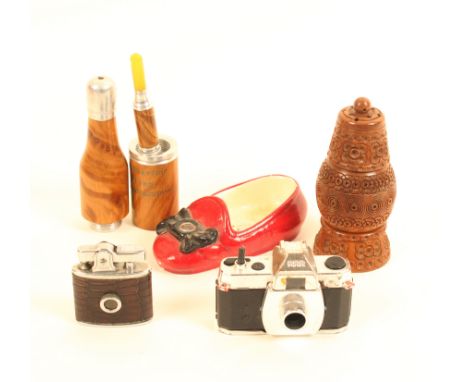 Five novelty items with Stanhopes comprising a coquilla sifter (Bethleem-distorted), 10cm, a plaster shoe, (colour coastal vi
