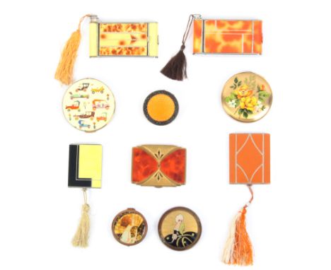 Ten vintage powder compacts comprising two camera form examples incorporating cigarette cases, and lipsticks, both in mottled