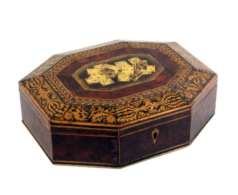 A Regency burr yew wood playing card box of octagonal for with boxwood line inlay, the lid with a panel of coloured playing c