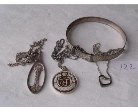 Three silver pendant necklaces and a bangle    
