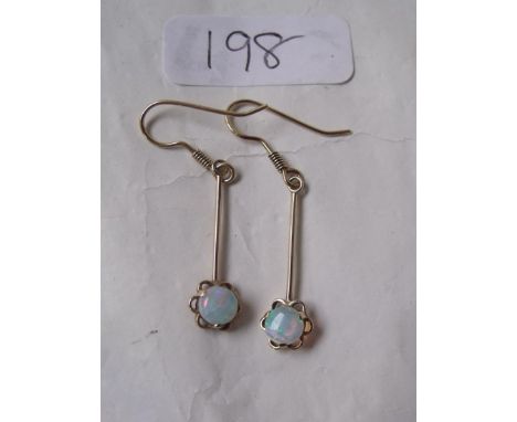 A pair of gold mounted opal ear drops    