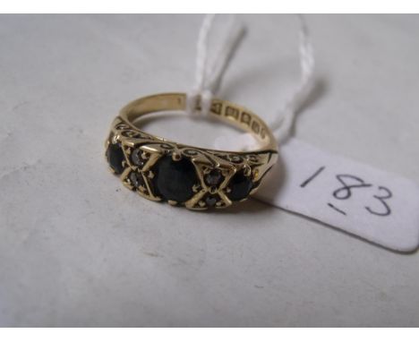 An antique sapphire and diamond carved ring  mounted in 18ct gold hall marks for Chester    