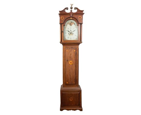 An oak moonphase longcase clock the eight-day duration movement striking the hours on a bell with the twelve-inch break-arch 