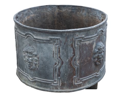 A lead garden planter, in early 18th century taste, modern; of cylindrical form, the panelled exterior with lions' masks in r