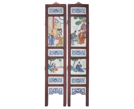 A pair of Chinese porcelain and stained wood screen sections each mounted with six porcelain panels decorated with figural su
