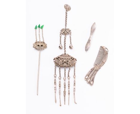 A group of four Chinese white metal items including a chateleine with attachments, a hair pin with green hardstone drops, a c