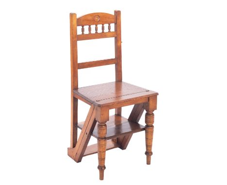 A late Victorian oak and beechwood four tread folding library step chair, the back with arched top rail with roundel ornament
