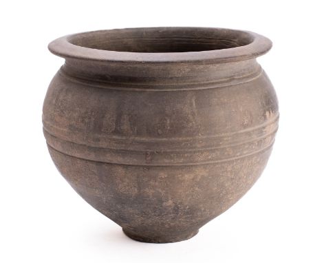 A Romano British greyware vessel, circa 1st /2nd century A.D.; wheel thrown with everted rim and ribbed exterior, (with circa