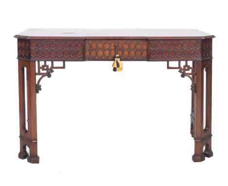 A mahogany inverted breakfront side table in 'Chinese Chippendale' taste, 19th century; the top with moulded edges; the front