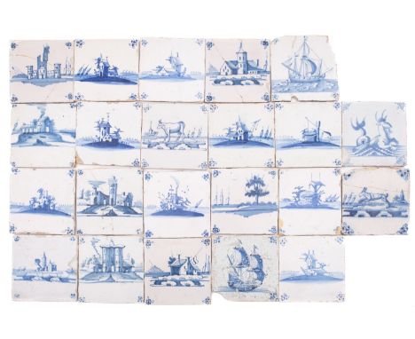 A group of twenty-two Dutch and English blue and white delftware tiles painted predominantly with buildings in landscapes, an