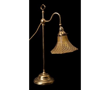 A brass and glass adjustable student's lamp in Arts & Crafts taste, circa 1900; with mottled yellow and black shade and later