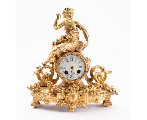 A mid-Victorian gilt-metal clock the eight-day duration movement striking the hours and half-hours on a bell with an outside 