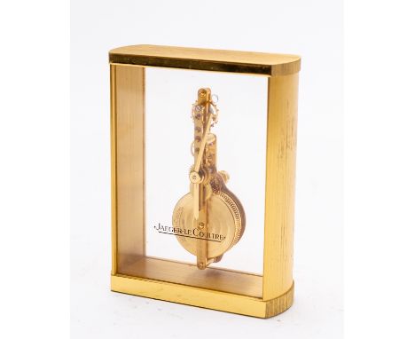 Jaeger-LeCoultre a rectangular gilt-brass and perspex mantel clock having an eight-day duration jeweled skeletonised in-line 