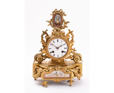 A mid-Victorian French gilt-metal and porcelain mantel clock the eight-day duration movement striking the hours and half-hour