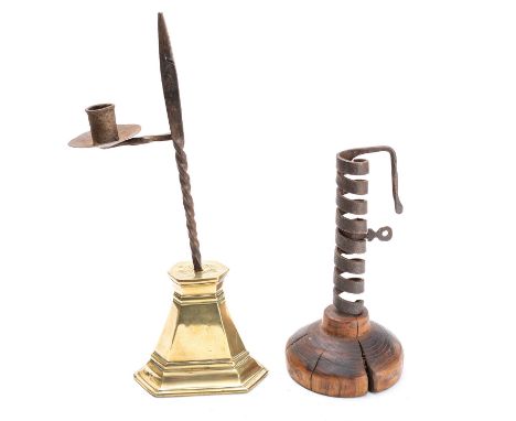A wrought iron and walnut mounted 'rat de cave' candlestick, late 18th century, the candle socket with a spiral formed column