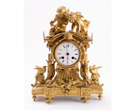 A mid-Victorian gilt-metal clock the eight-day duration movement striking the hours and half-hours on a bell with the round w